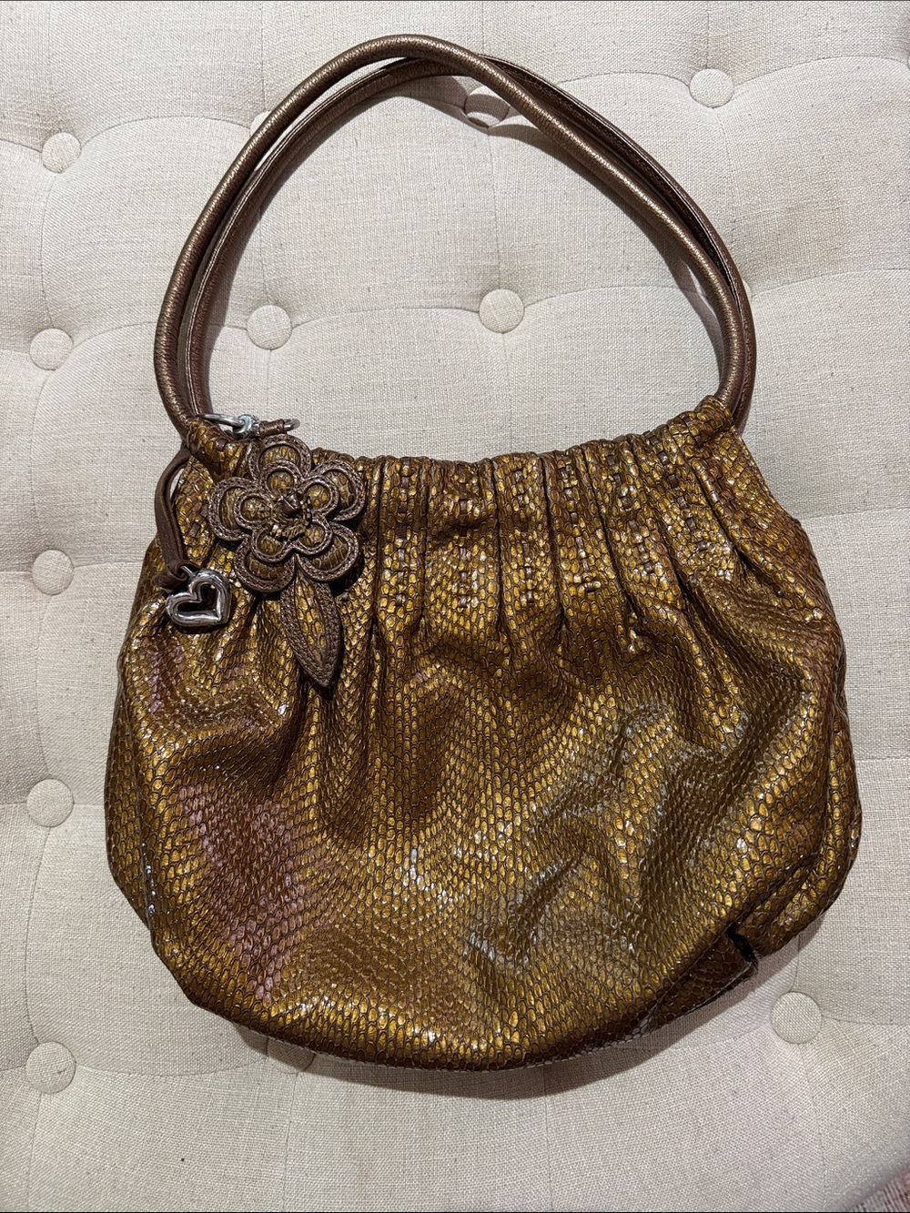 Brighton Metallic Bronze Shoulder Bag with Floral Charm